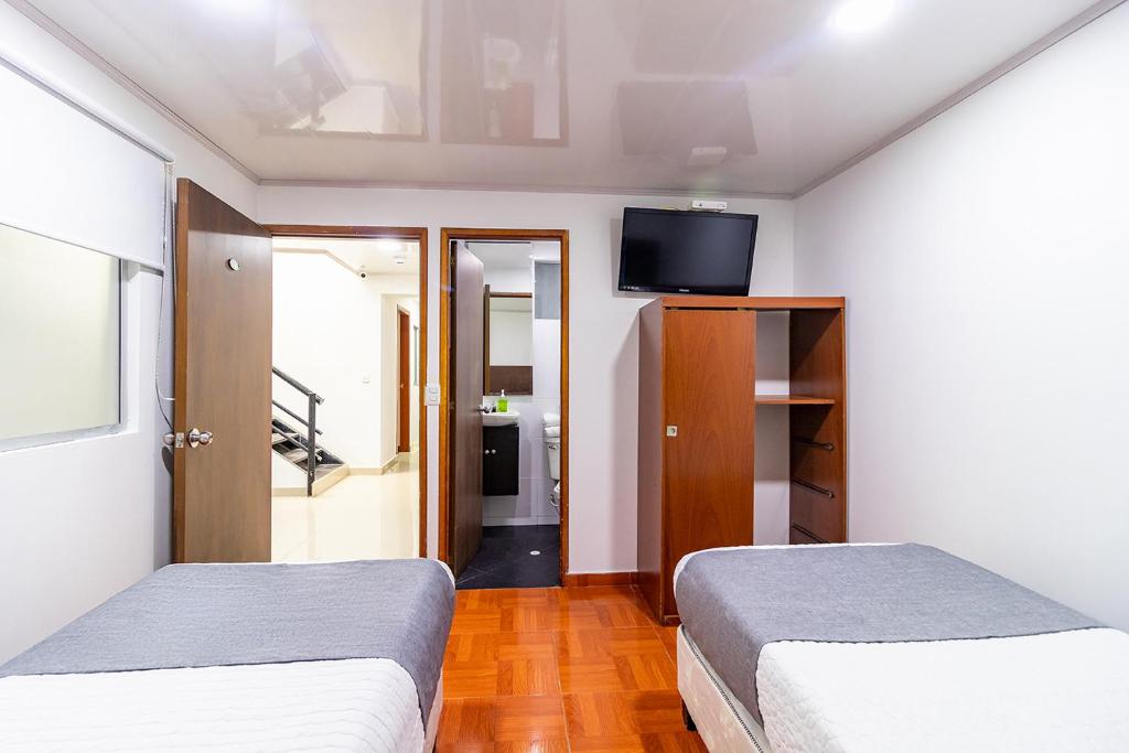 Postel nebo postele na pokoji v ubytování Hotel Harrington 63