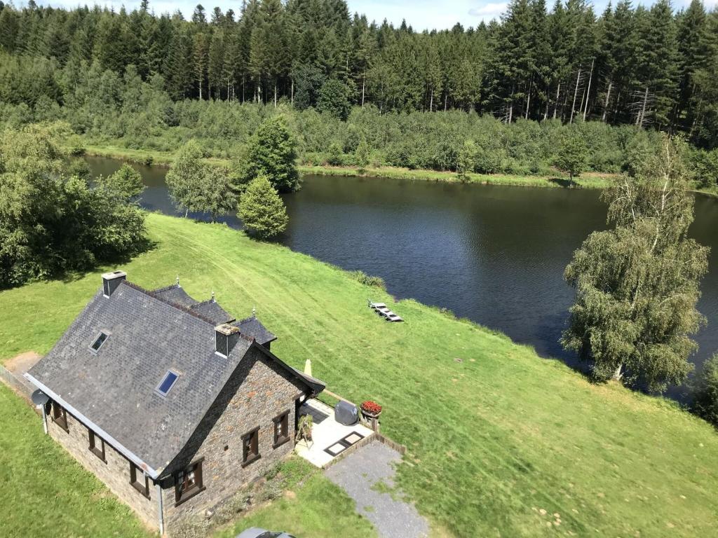 an aerial view of a house next to a lake at Lakeside Getaway in Bouillon in Bouillon
