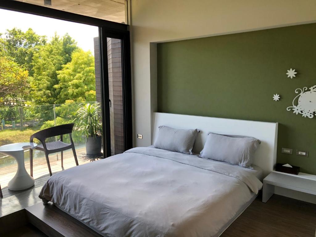 Postel nebo postele na pokoji v ubytování One Piece B&B
