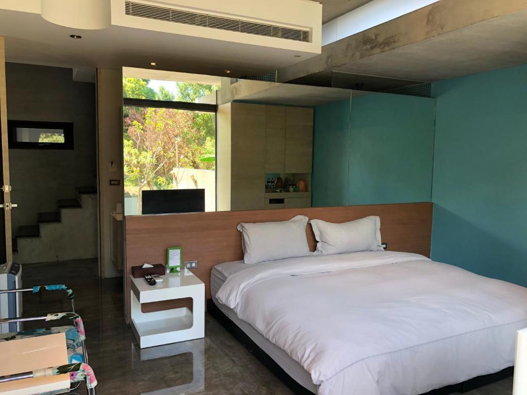 Postel nebo postele na pokoji v ubytování One Piece B&B