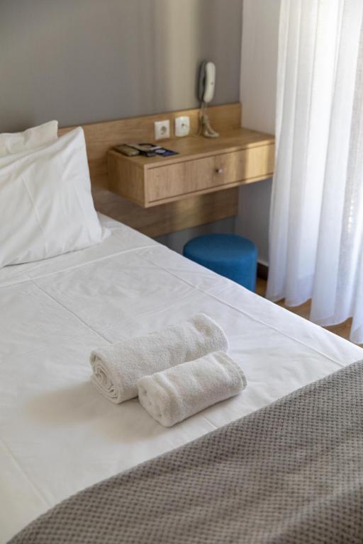 Postel nebo postele na pokoji v ubytování Olympos Hotel