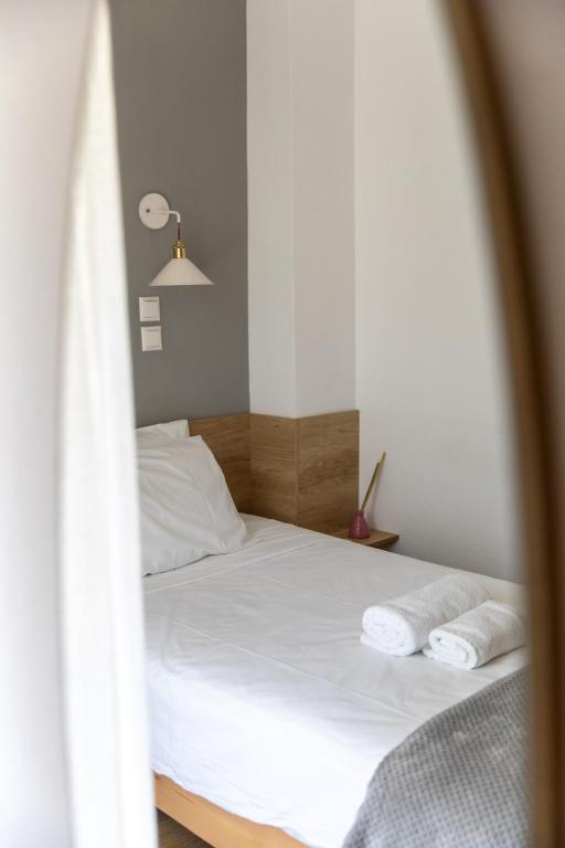 Postel nebo postele na pokoji v ubytování Olympos Hotel
