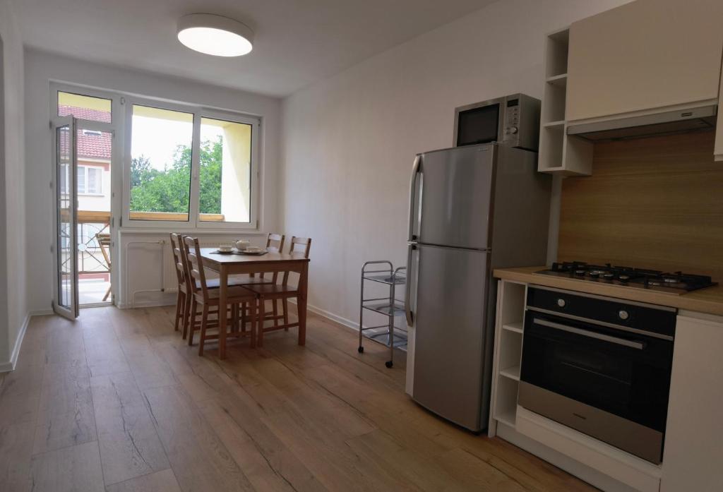 Kuchyň nebo kuchyňský kout v ubytování Apartmán Športová