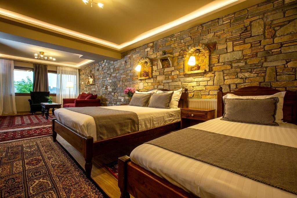 Łóżko lub łóżka w pokoju w obiekcie La Noi Guesthouse
