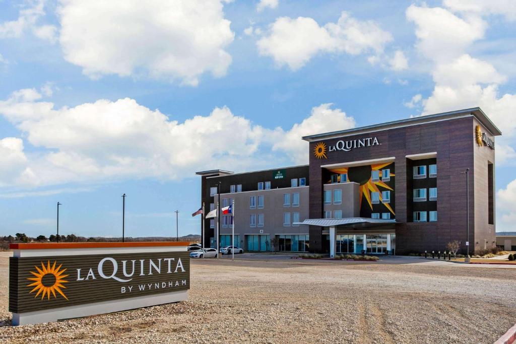 a large building with a sign in front of it at La Quinta by Wyndham Sweetwater East in Sweetwater