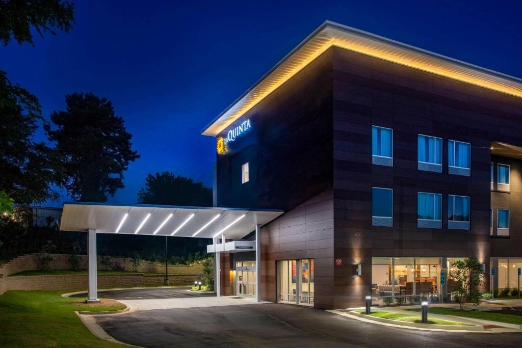 a rendering of a hotel with a building at La Quinta Inn & Suites by Wyndham Oxford in Oxford
