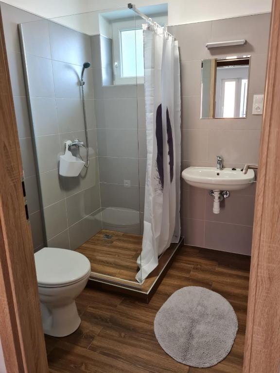 Kúpeľňa v ubytovaní Holdudvar Apartman