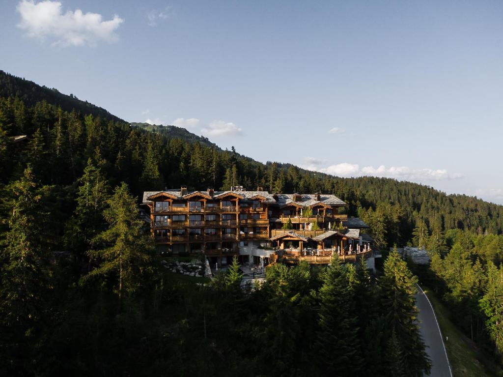 an aerial view of a resort in the mountains at LeCrans in Crans-Montana