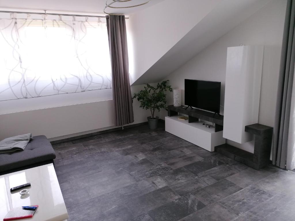 TV a/nebo společenská místnost v ubytování Stollis FeWo