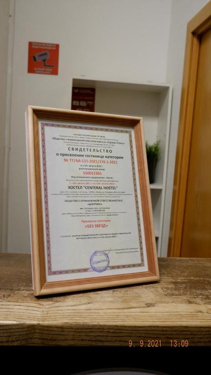 a framed certificate sitting on top of a table at Centeral Hostel Moscow in Moscow