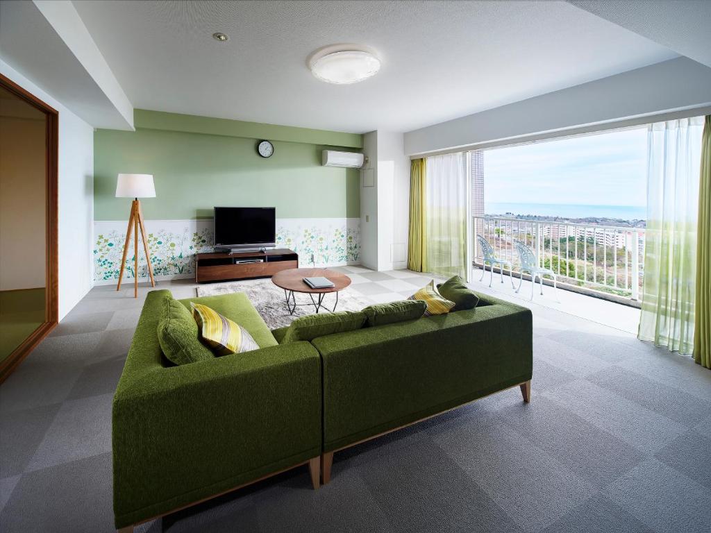 TV a/nebo společenská místnost v ubytování Hotel Village Izukogen