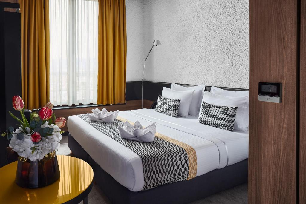 Postel nebo postele na pokoji v ubytování Hotel Panoramika Design & Spa