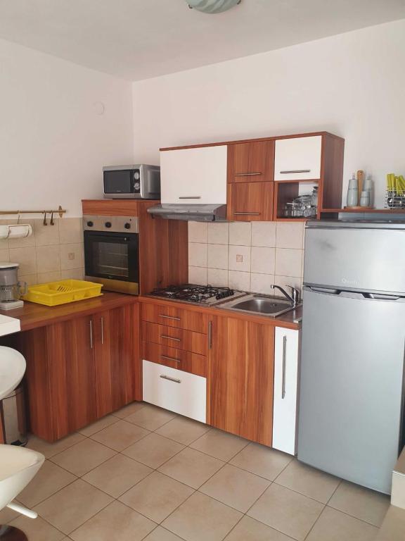Kuchyň nebo kuchyňský kout v ubytování Apartment Kos