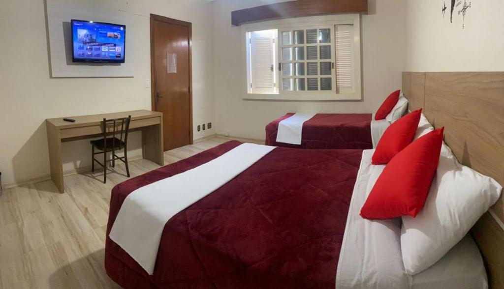 Postel nebo postele na pokoji v ubytování Casa do Rogerio Hostel - Unidade Shopping