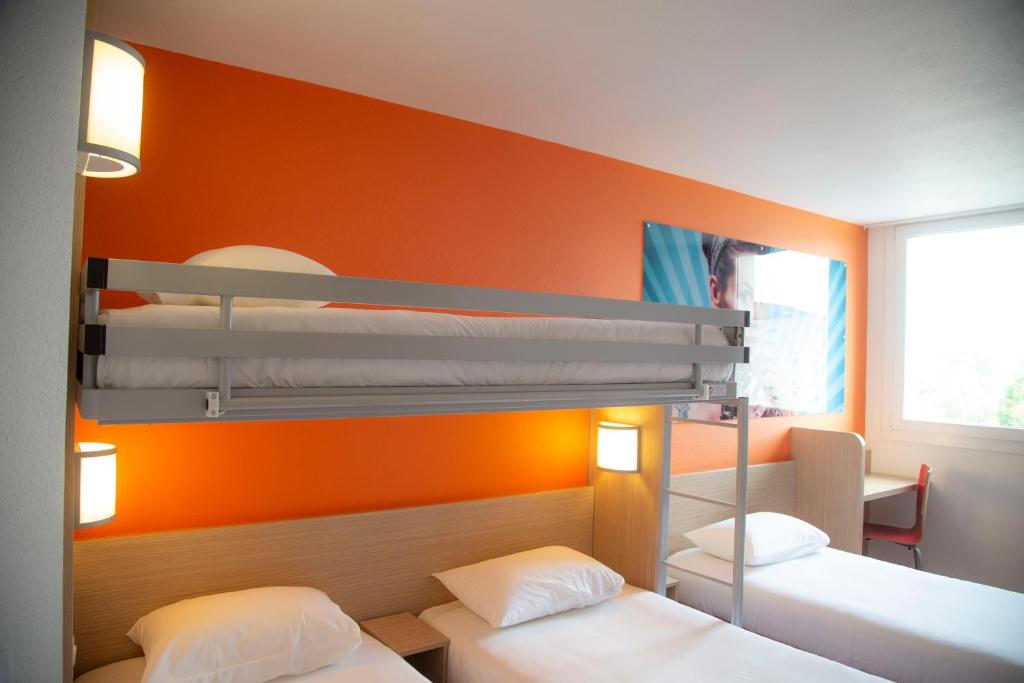 Postel nebo postele na pokoji v ubytování Kyriad Direct Arras - Saint-Laurent-Blangy - Parc Expo