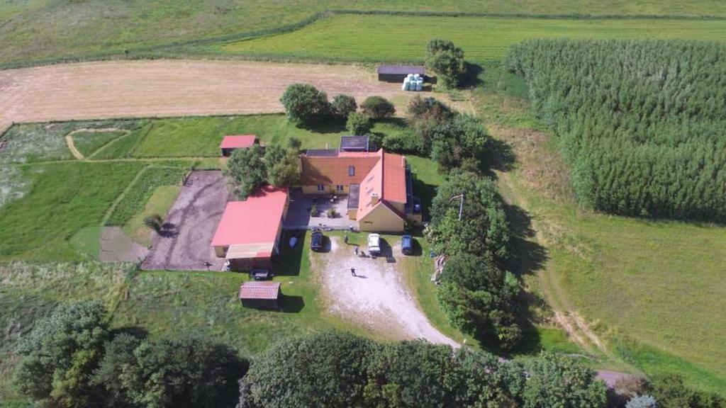 an aerial view of a large house in a field at Munkebo B&B, Thy in Thisted