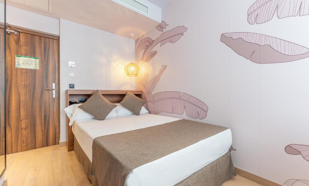 Postel nebo postele na pokoji v ubytování DWO Nopal