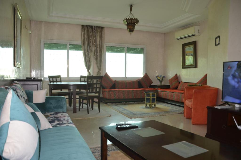 a living room with a couch and a table at Center Medina in Fez