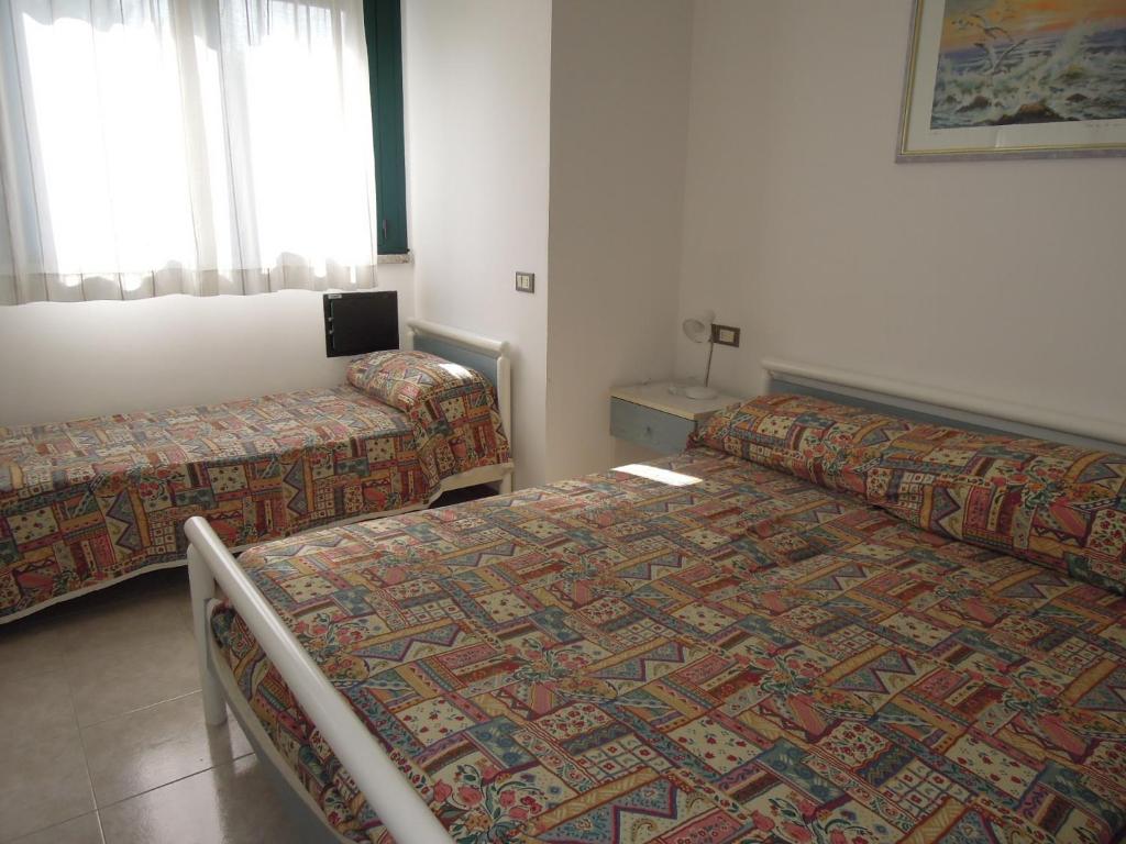 A bed or beds in a room at Residence delle Terme