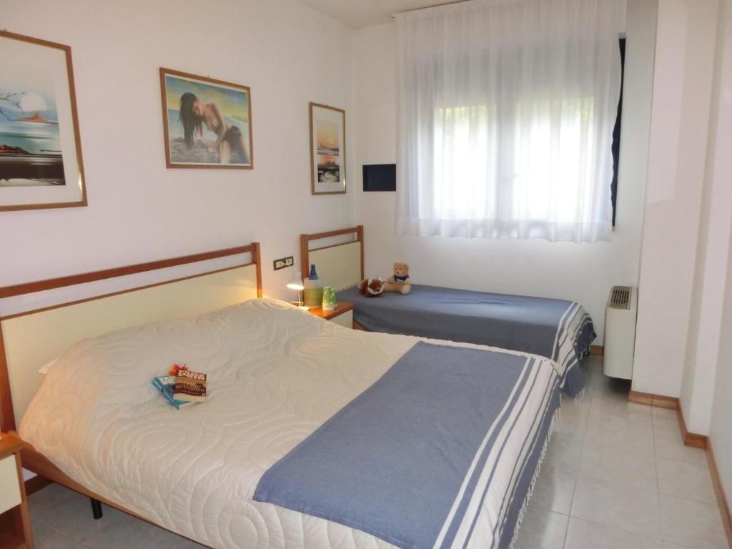 A bed or beds in a room at Residence delle Terme