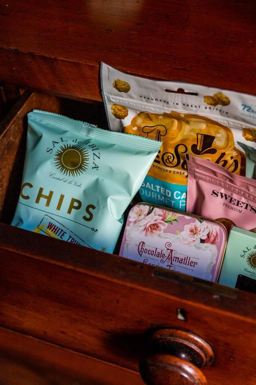 a drawer filled with different types of snacks at Molenmeers Boutique Guesthouses in Bruges