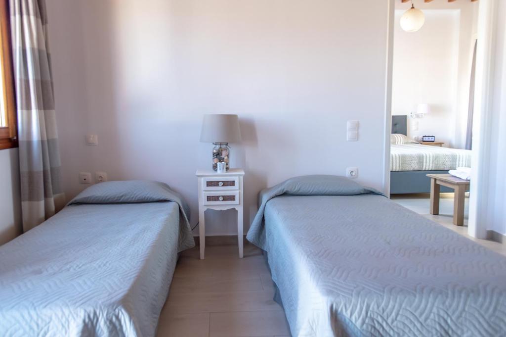 Postel nebo postele na pokoji v ubytování Stefanos Studios