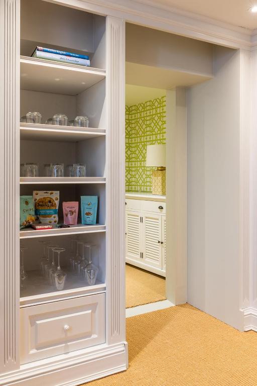 a kitchen with a pantry with white shelves at Molenmeers Boutique Guesthouses in Bruges