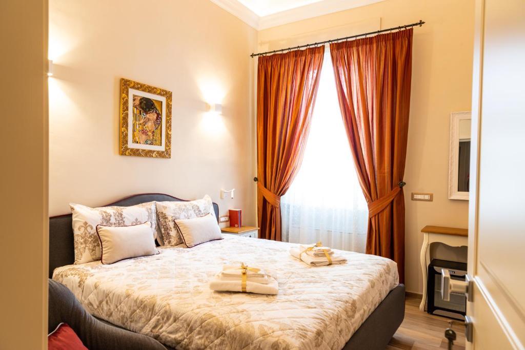 a bedroom with a bed with two towels on it at Residenza Di Nucci in Termoli