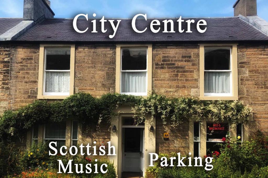 a brick building with a city centre sign on it at Averon Guest House in Edinburgh