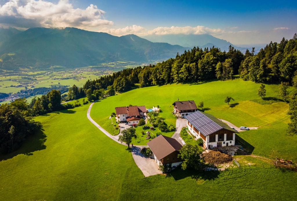 an aerial view of a house on a green field at Bio-Familienbauernhof Grubsteighof in Sankt Koloman