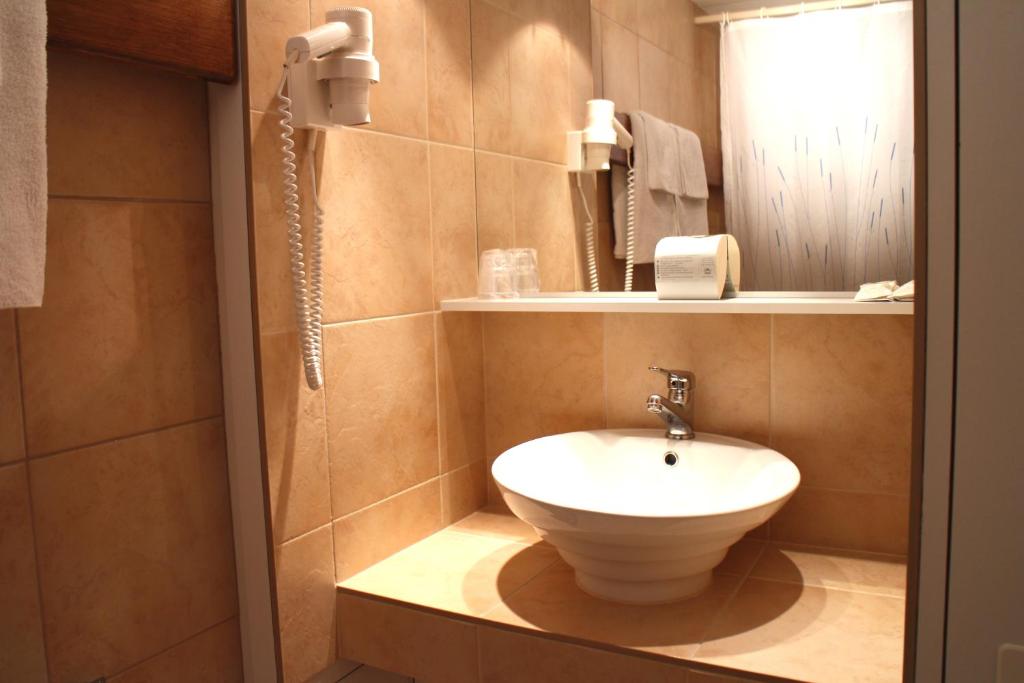Koupelna v ubytování Hotel Zodiaque