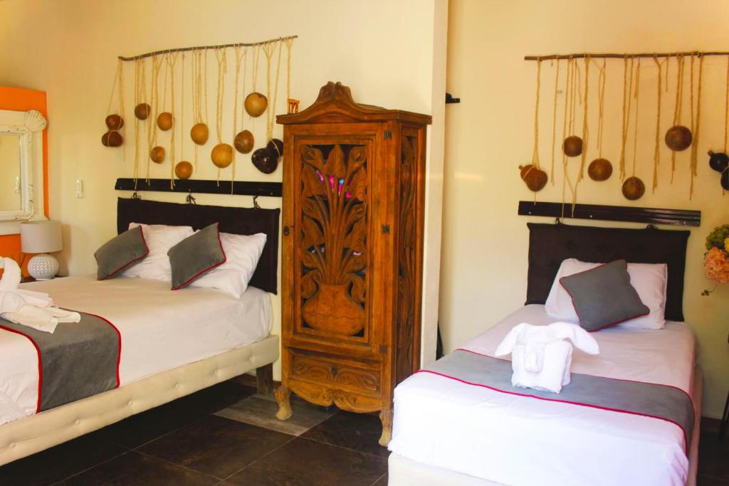 Postel nebo postele na pokoji v ubytování Casa Aluxes Hotel