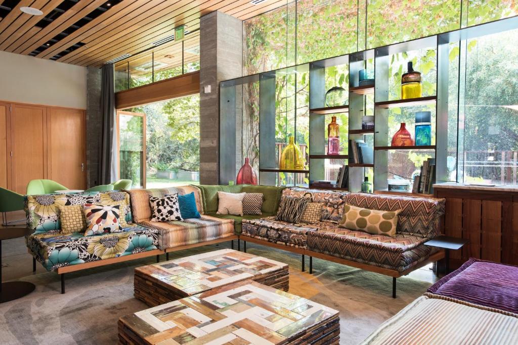 a living room filled with furniture and a window at H2hotel in Healdsburg