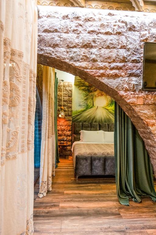 Postel nebo postele na pokoji v ubytování Vila Eden Boutique Hotel