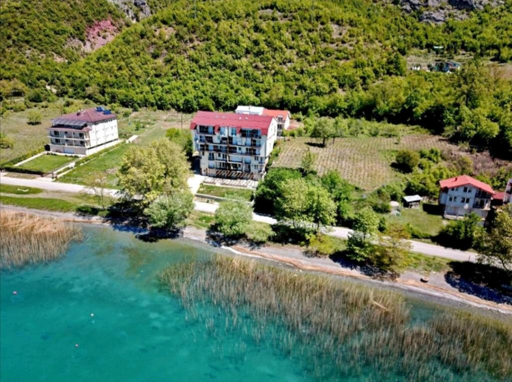 an aerial view of a house next to the water at Vera Apartments in Ohrid
