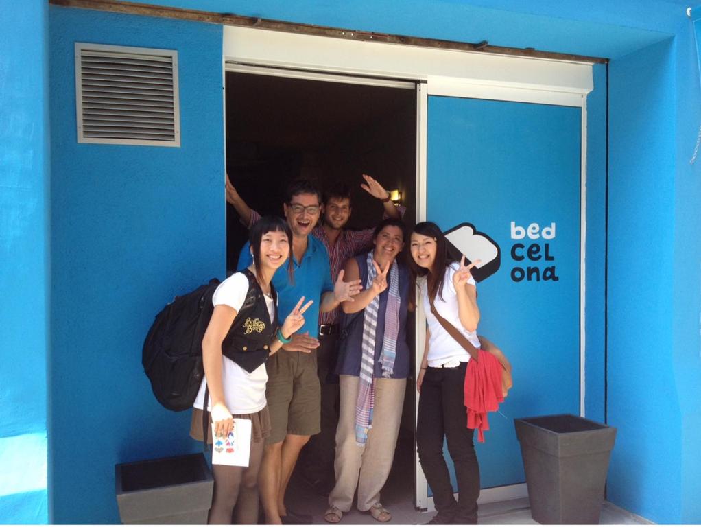 a group of people posing for a picture in a doorway at Bedcelona Hostel in Barcelona