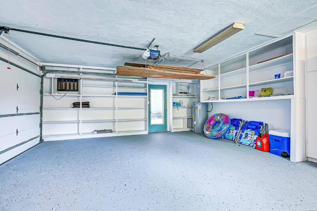 an empty room with white shelves and a room with a ball at Temporary Sanity in Sarasota