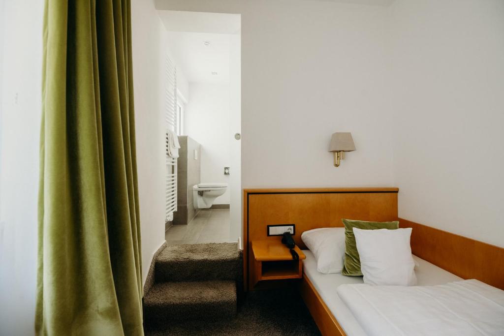 Postel nebo postele na pokoji v ubytování Hotel Crystal
