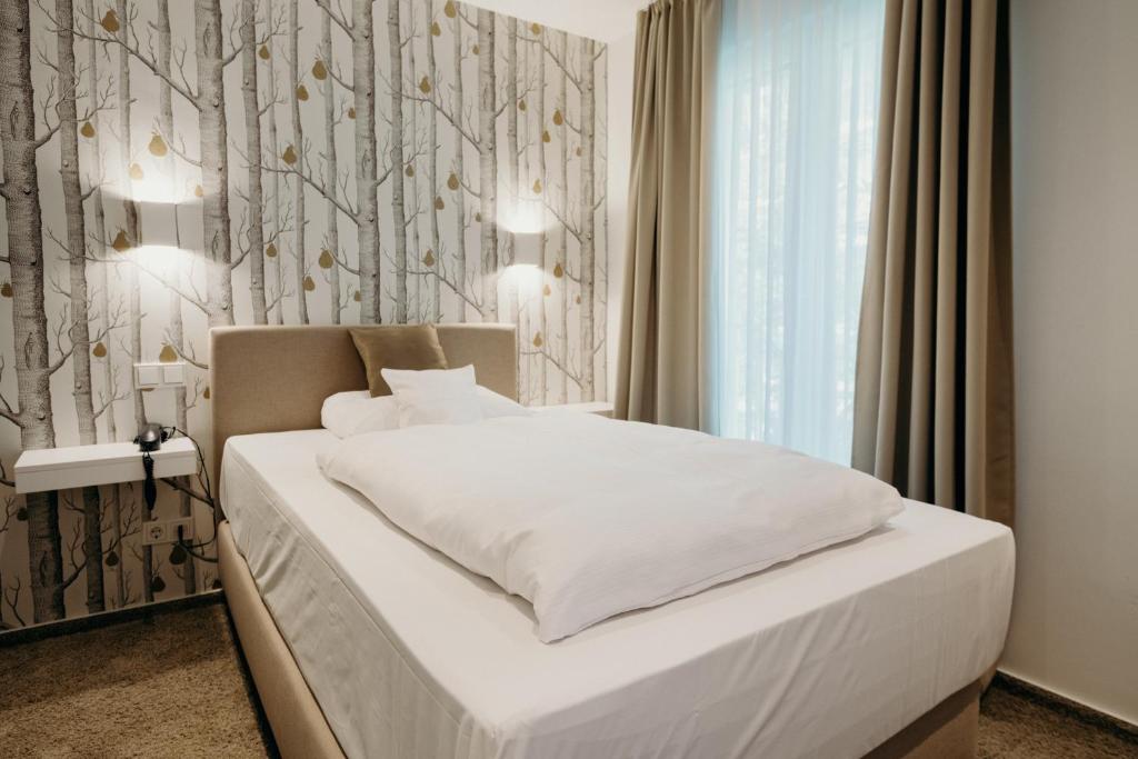 Postel nebo postele na pokoji v ubytování Hotel Crystal