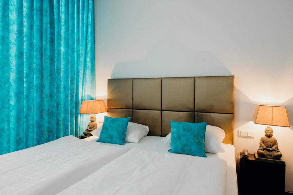Postel nebo postele na pokoji v ubytování Hotel Crystal