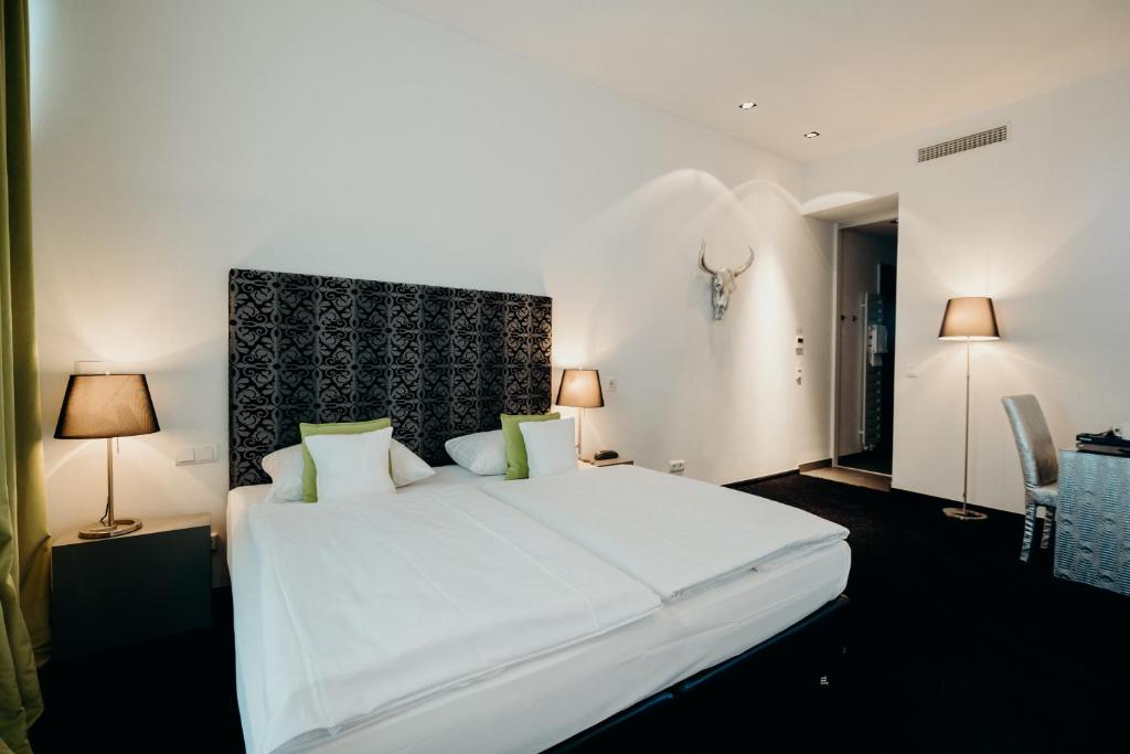 Postel nebo postele na pokoji v ubytování Hotel Crystal