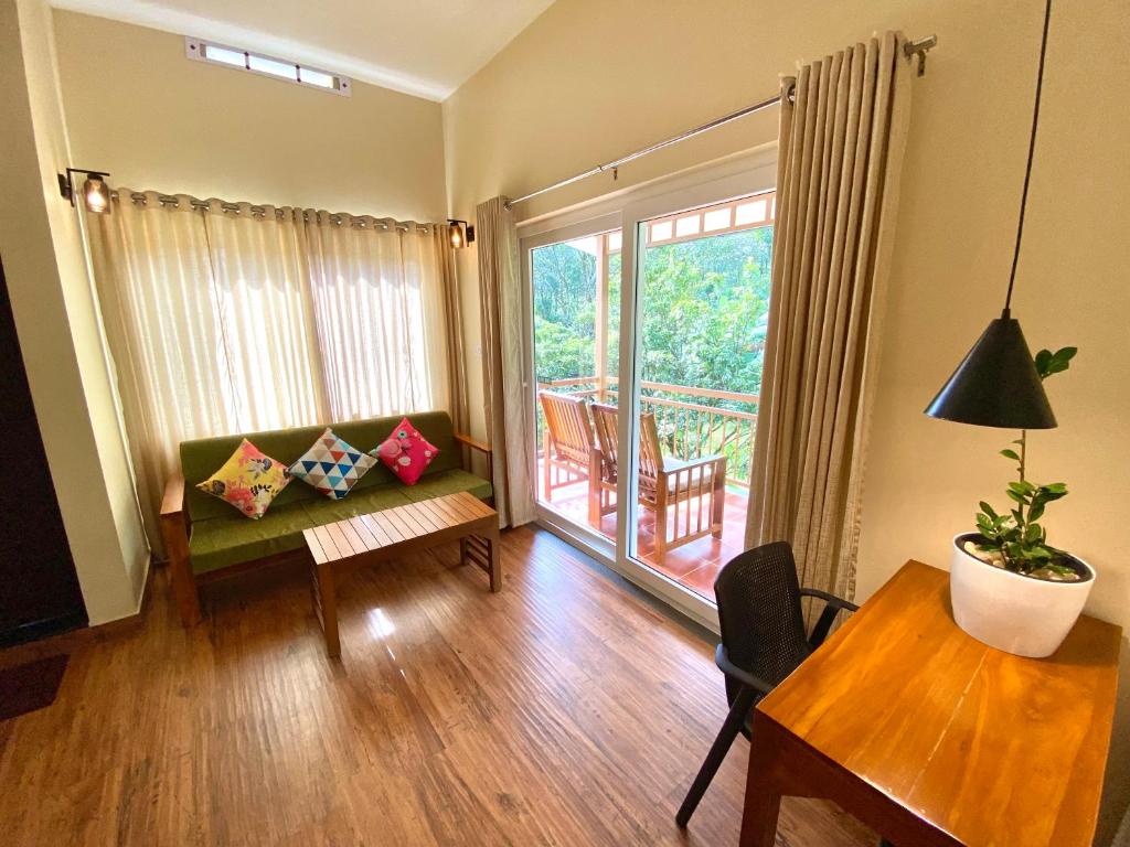 Area soggiorno di Flower Valley Plantation Homestay