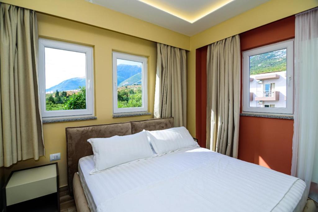 Postel nebo postele na pokoji v ubytování Hotel Orange