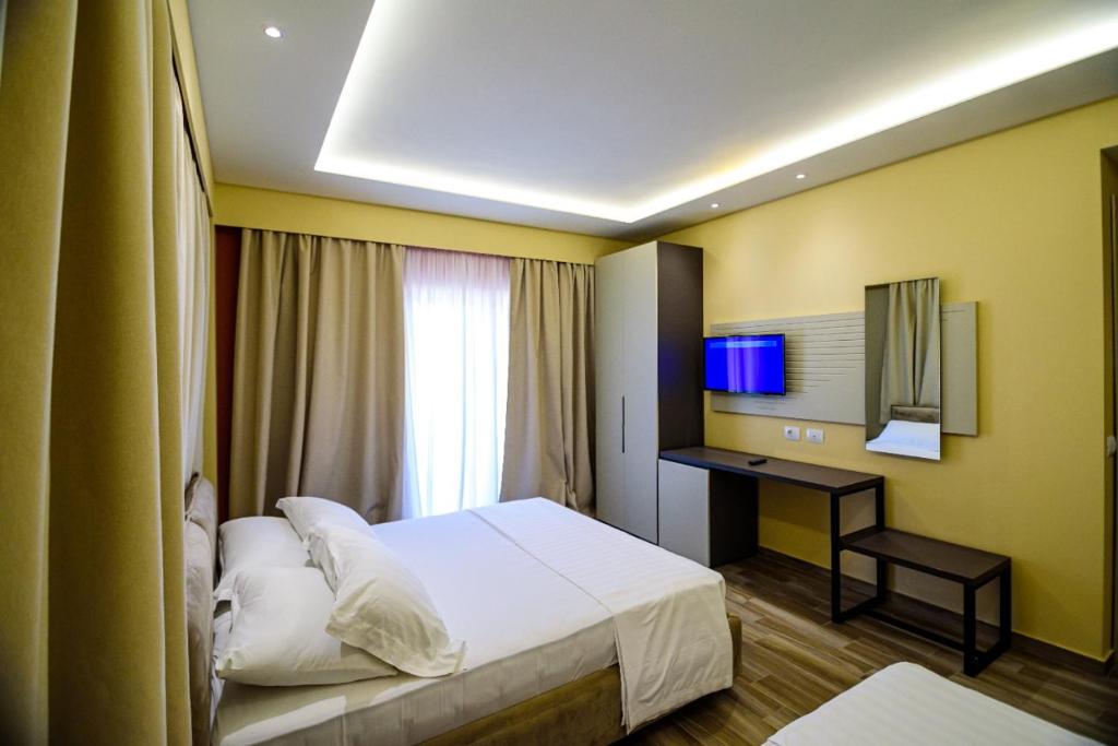 Postel nebo postele na pokoji v ubytování Hotel Orange