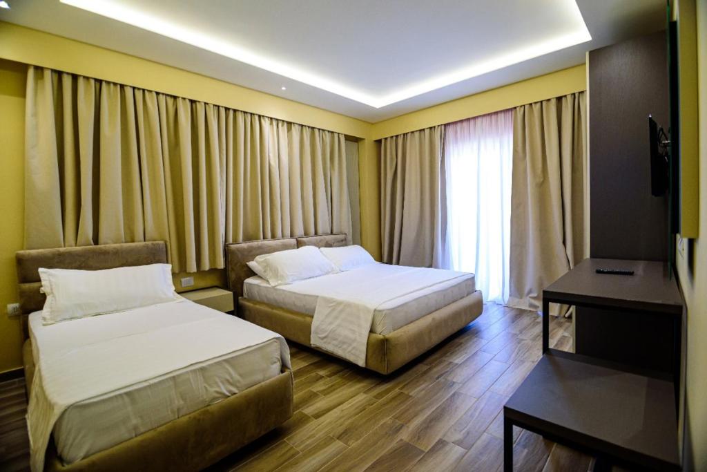 Postel nebo postele na pokoji v ubytování Hotel Orange
