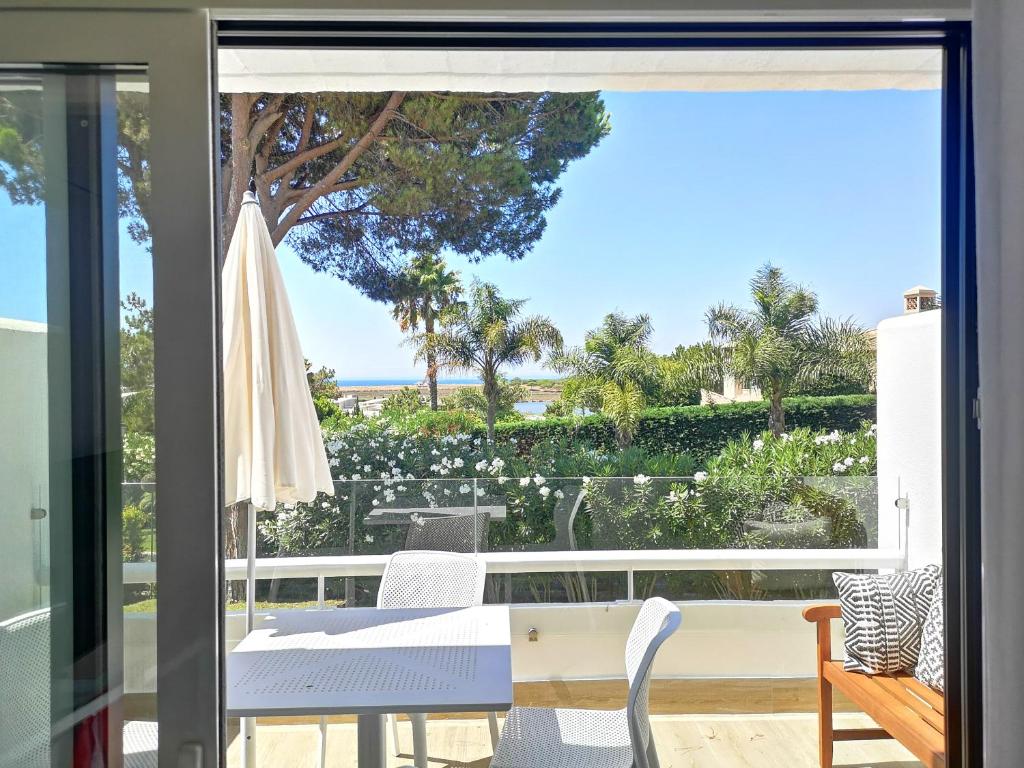 a view of the ocean from the balcony of a house at Victory Village 16F in Quinta do Lago
