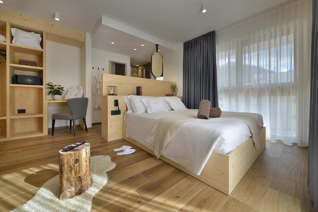 Postel nebo postele na pokoji v ubytování Hotel Valtellina