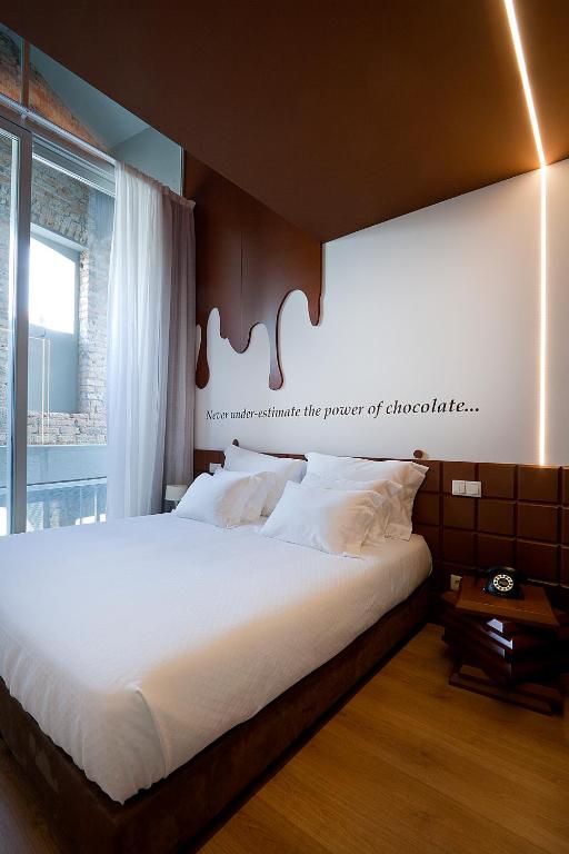 Postel nebo postele na pokoji v ubytování Hotel Fabrica do Chocolate