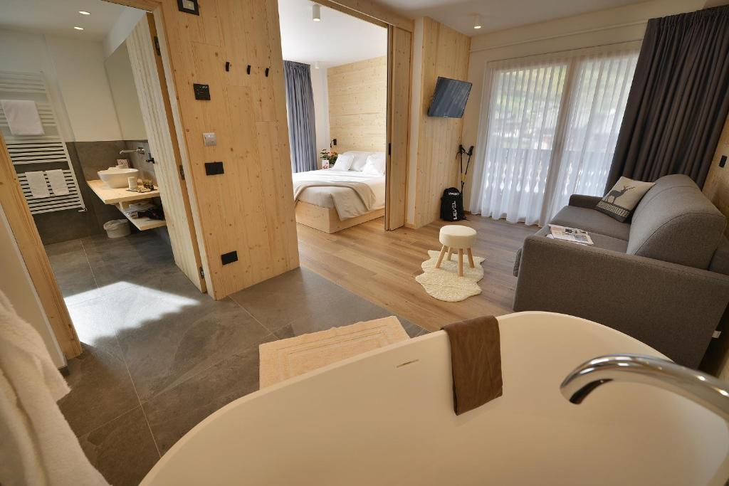Postel nebo postele na pokoji v ubytování Hotel Valtellina