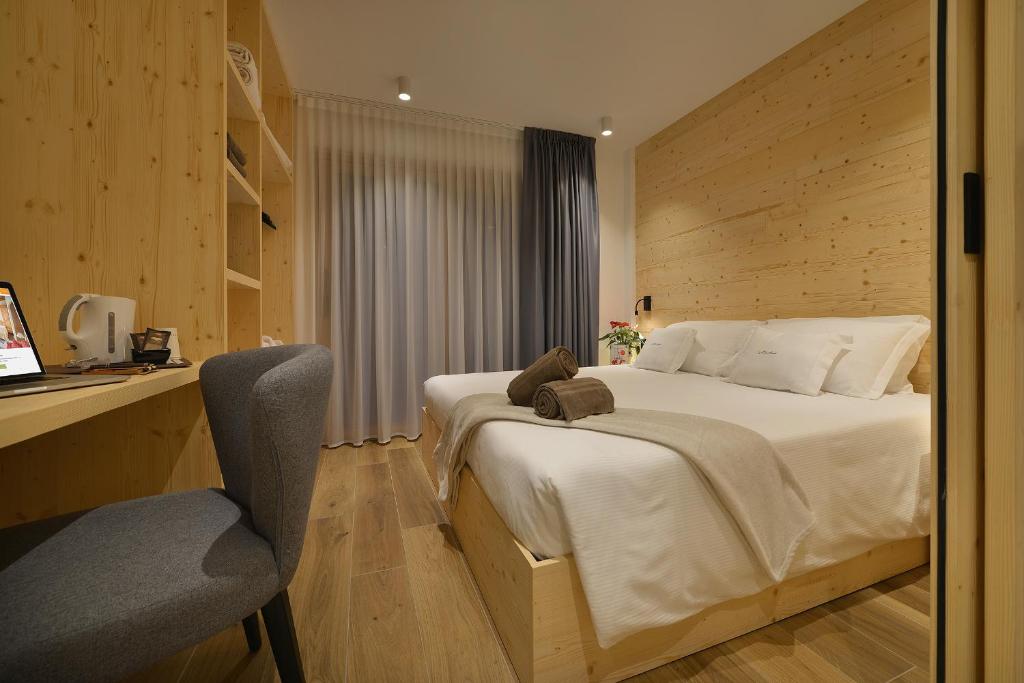 Postel nebo postele na pokoji v ubytování Hotel Valtellina